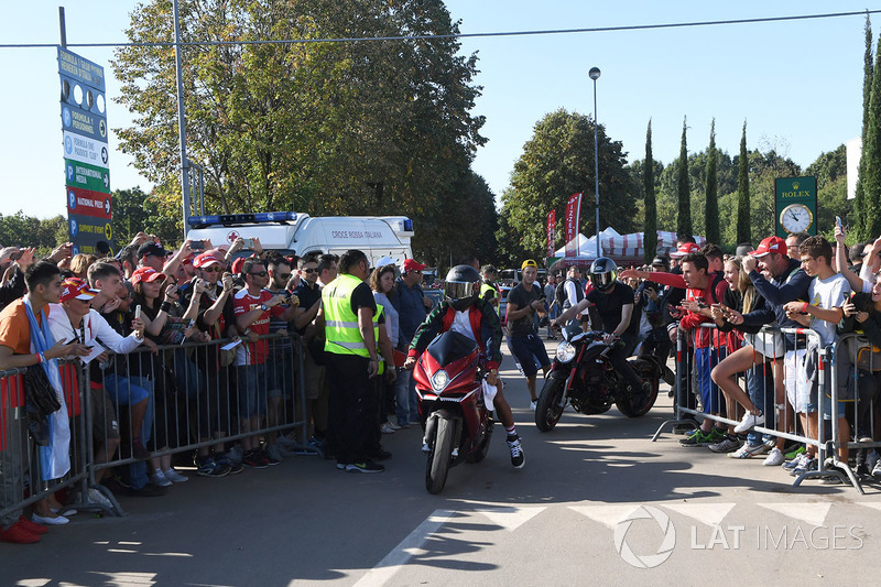 Lewis Hamilton, Mercedes AMG F1 arrives at the track on his motorbike