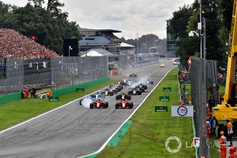 Sebastian Vettel, Ferrari SF71H and Kimi Raikkonen, Ferrari SF71H lead at the start of the race