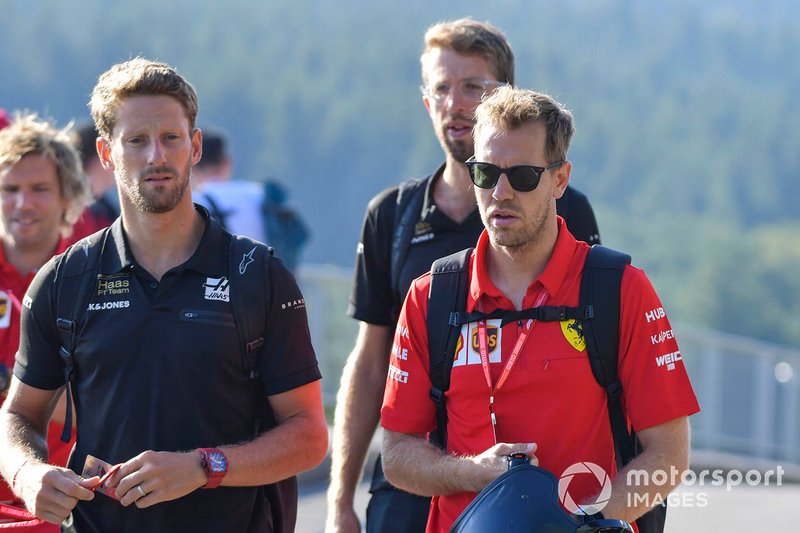 Romain Grosjean, Haas F1, and Sebastian Vettel, Ferrari