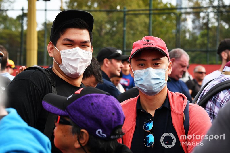 Fans wear protective masks in light of the coronavirus outbreak