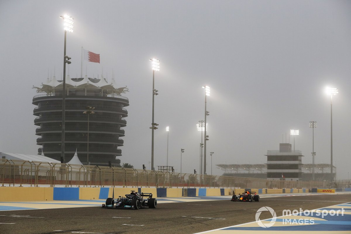 Lewis Hamilton, Mercedes W12, and Max Verstappen, Red Bull Racing RB16B
