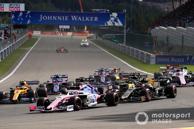 Sergio Perez, Racing Point RP19, leads Kevin Magnussen, Haas F1 Team VF-19, Lando Norris, McLaren MCL34, Romain Grosjean, Haas F1 Team VF-19, Daniel Ricciardo, Renault F1 Team R.S.19, and the remainder of the field at the start