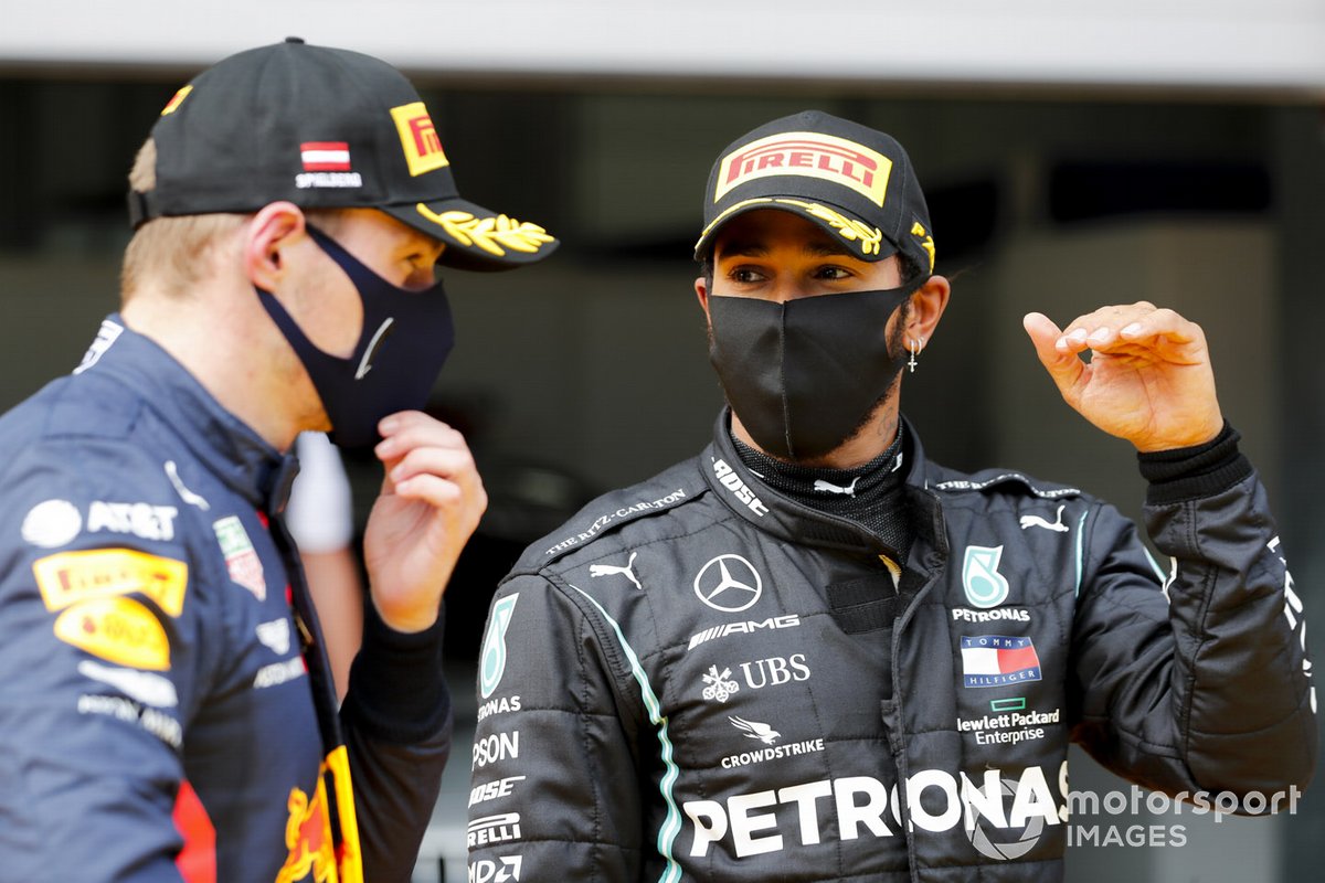 Max Verstappen, Red Bull Racing and Race Winner Lewis Hamilton, Mercedes-AMG Petronas F1 celebrate in Parc Ferme