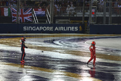Kimi Raikkonen, Ferrari and Max Verstappen, Red Bull Racing walk in after crashing at race start