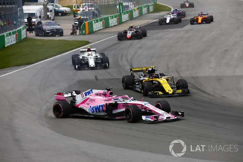 A sideways Sergio Perez, Force India VJM11, battles with Carlos Sainz Jr., Renault Sport F1 Team R.S