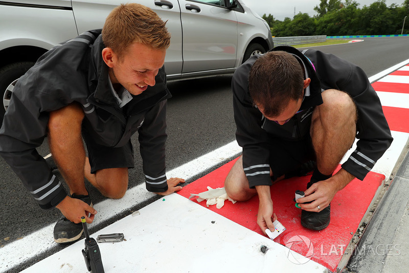 Track workers working on the kerbs and the track