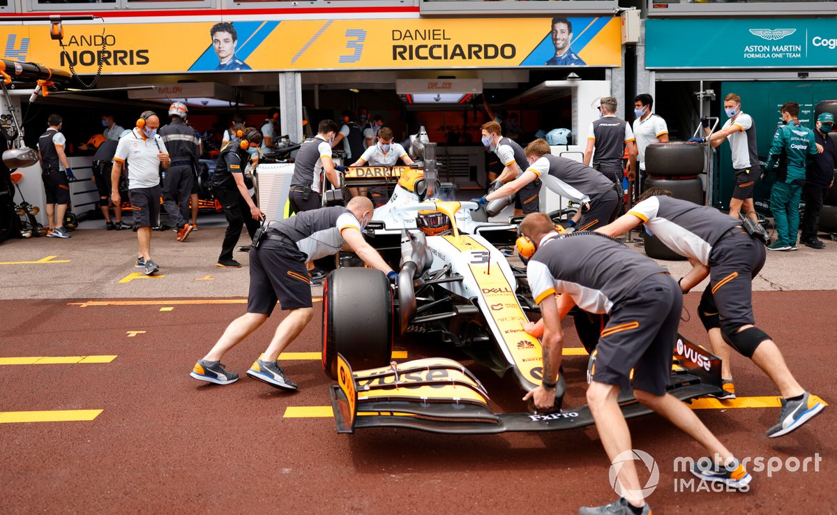 Daniel Ricciardo, McLaren MCL35M, is returned to the garage