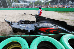 The McLaren MP4-31 of Fernando Alonso, McLaren is removed from the gravel trap after his race stoppi