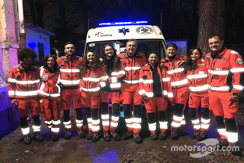 Pirelli racing manager Mario Isola, middle, volunteering as ambulance driver in Milan