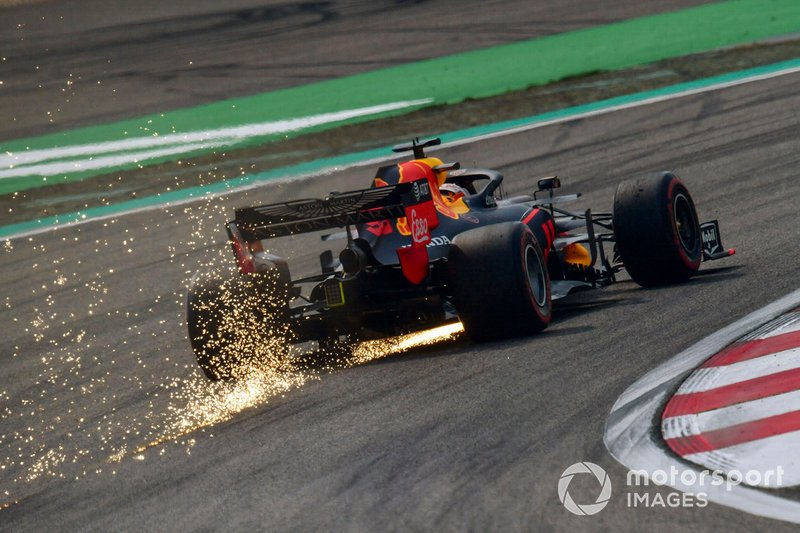 Sparks kick up from the rear of Max Verstappen, Red Bull Racing RB15