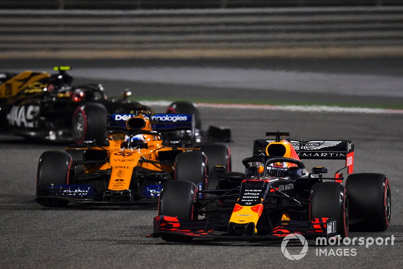 Max Verstappen, Red Bull Racing RB15, leads Carlos Sainz Jr., McLaren MCL34, and Kevin Magnussen, Haas F1 Team VF-19