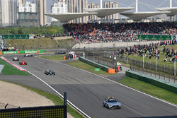 Safety car leads the field