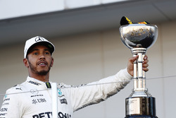 Lewis Hamilton, Mercedes AMG F1, celebrates with his winner's trophy on the podium