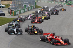 Sebastian Vettel, Ferrari SF71H, leads Max Verstappen, Red Bull Racing RB14, Valtteri Bottas, Merced