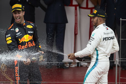 Lewis Hamilton, Mercedes AMG F1, and Race winner Daniel Ricciardo, Red Bull Racing, sprays with Champagne