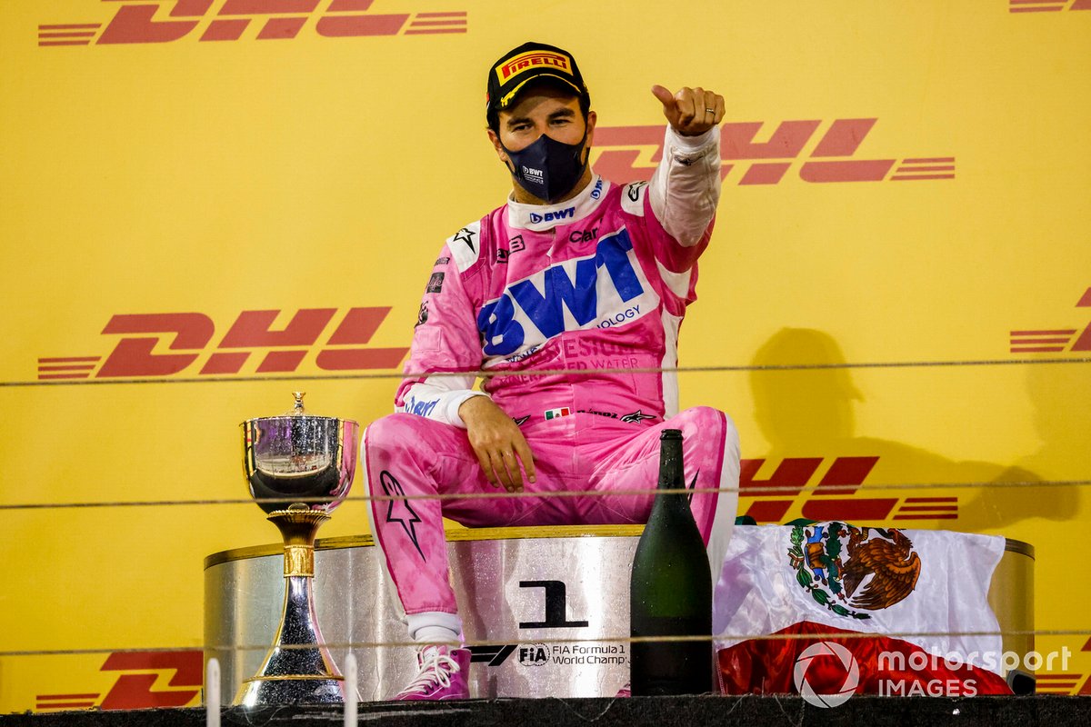 Sergio Perez, Racing Point, 1st position, takes a seat on the podium