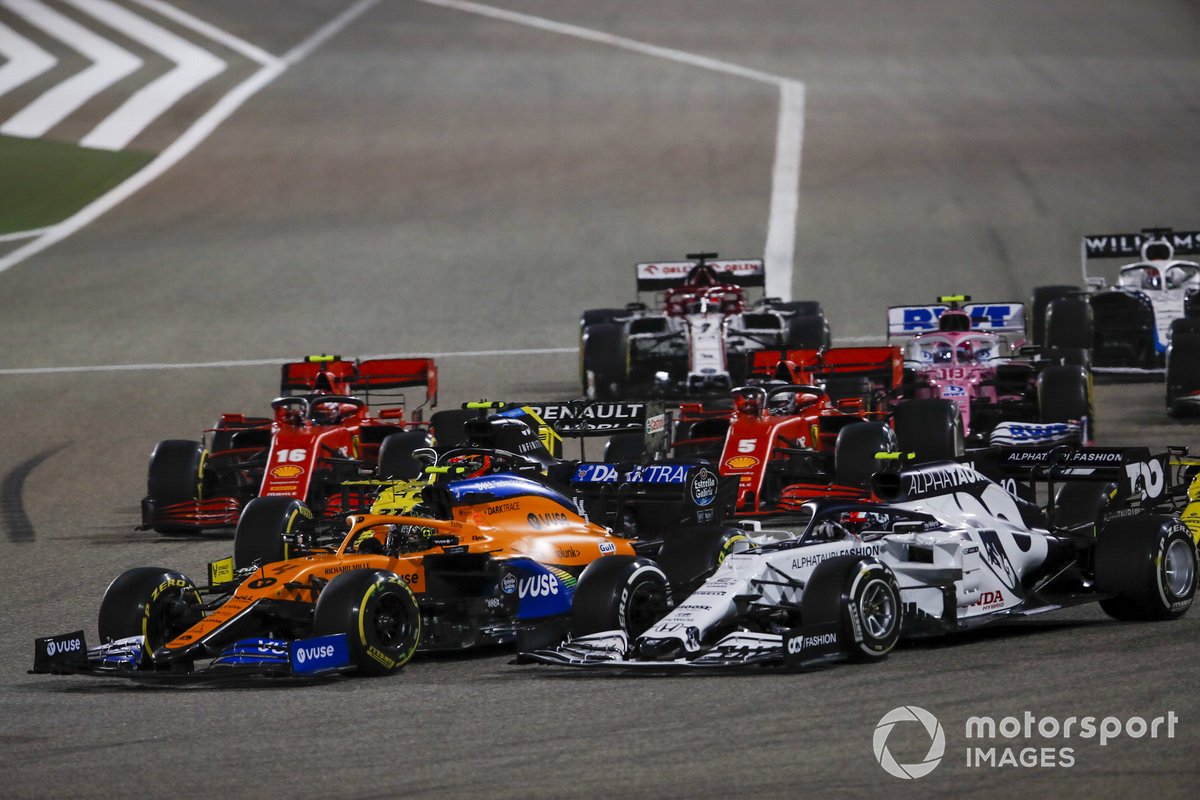 Lando Norris, McLaren MCL35, Pierre Gasly, AlphaTauri AT01, Sebastian Vettel, Ferrari SF1000, Charles Leclerc, Ferrari SF1000, Lance Stroll, Racing Point RP20, and Kimi Raikkonen, Alfa Romeo Racing C39, at the restart