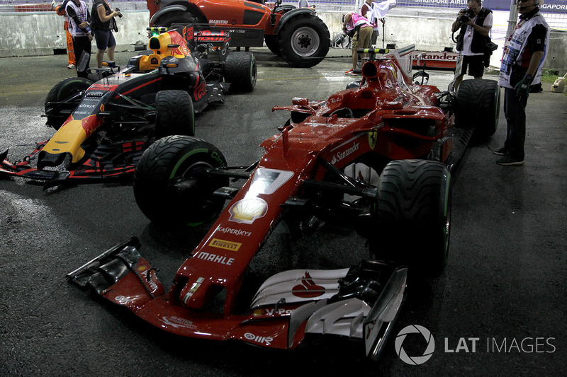 The damaged cars of Max Verstappen, Red Bull Racing RB13 and Kimi Raikkonen, Ferrari SF70H after crashing out at the start of the race