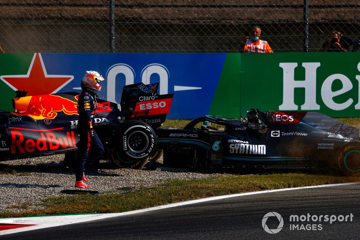 Max Verstappen, Red Bull Racing RB16B, walks away from his car after crashing out with Lewis Hamilton, Mercedes