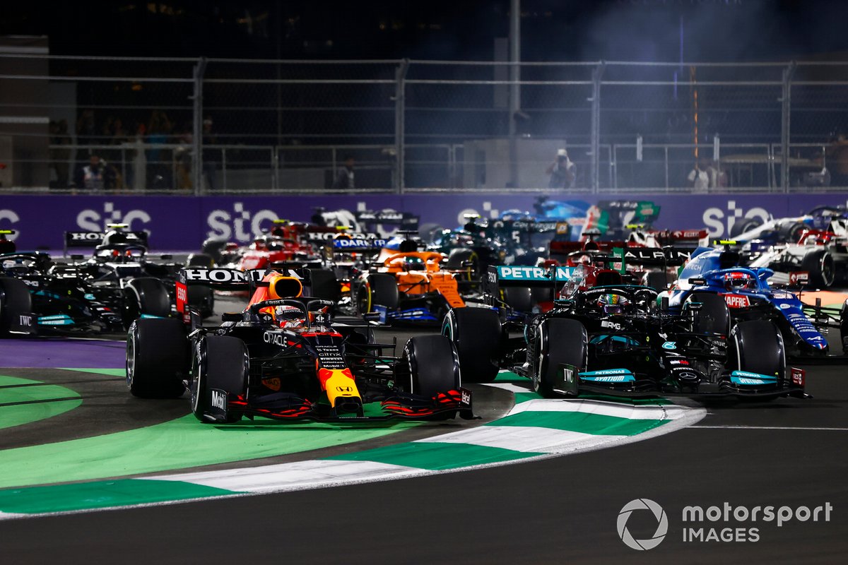 Max Verstappen, Red Bull Racing RB16B, runs off the track while battling with Lewis Hamilton, Mercedes W12 at the restart