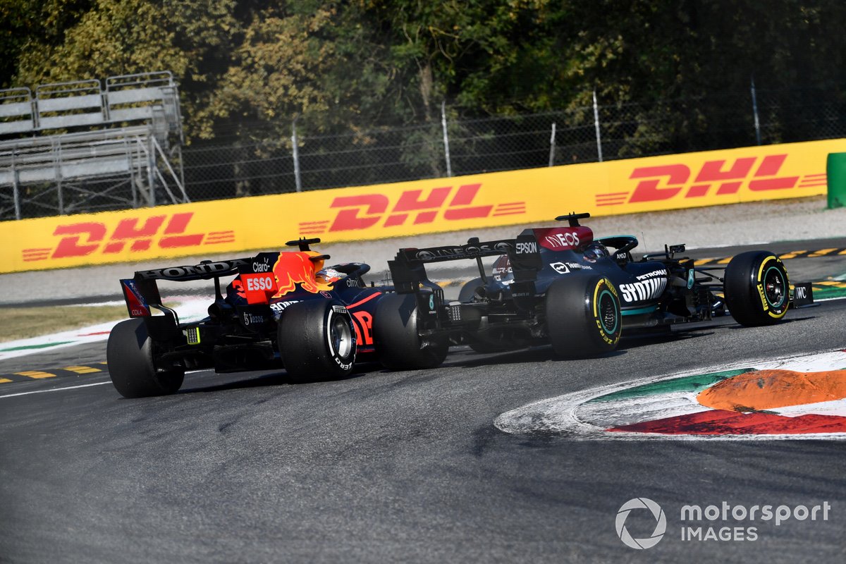 Max Verstappen, Red Bull Racing RB16B, and Lewis Hamilton, Mercedes W12, collide