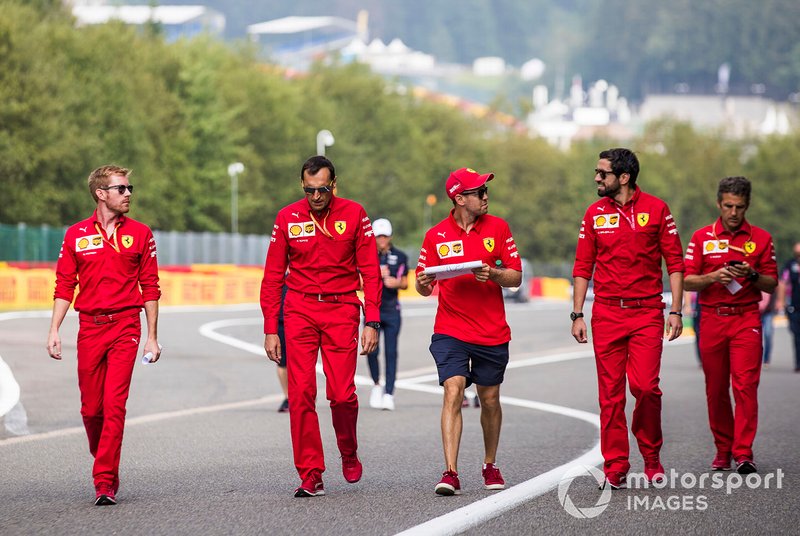 Sebastian Vettel, Ferrari, walks the track with colleagues