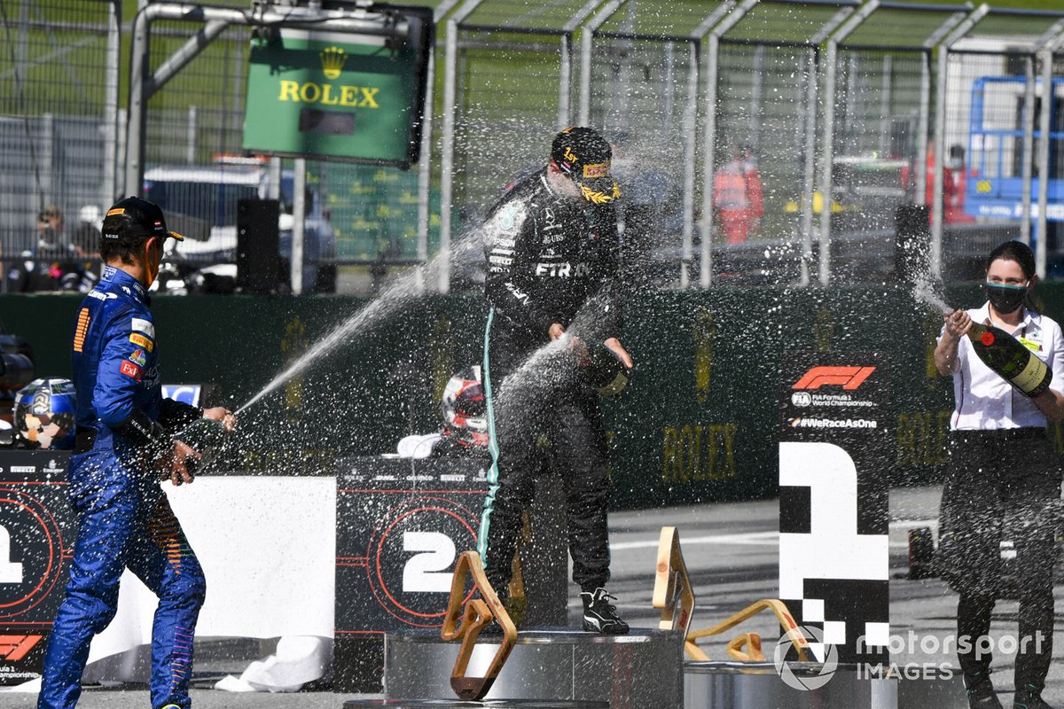 Race winner Valtteri Bottas, Mercedes-AMG Petronas F1, second place Charles Leclerc, Ferrari, third place Lando Norris, McLaren celebrate on the podium with the champagne
