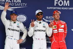 (L to R): Valtteri Bottas, Mercedes AMG F1, pole sitter Lewis Hamilton, Mercedes AMG F1 and Sebastian Vettel, Ferrari celebrate in parc ferme