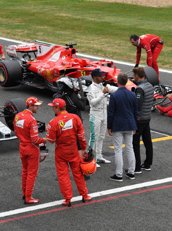 Sebastian Vettel, Ferrari and Kimi Raikkonen, Ferrari watch pole sitter Lewis Hamilton, Mercedes AMG F1 talks, Jenson Button, McLaren in parc ferme in parc ferme