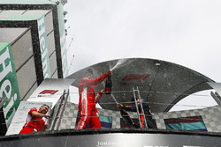 Sebastian Vettel, Ferrari, 1st position, sprays Champagne from the podium
