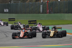 Fernando Alonso, McLaren MCL32, battles Nico Hulkenberg, Renault Sport F1 Team RS17, ahead of Esteba