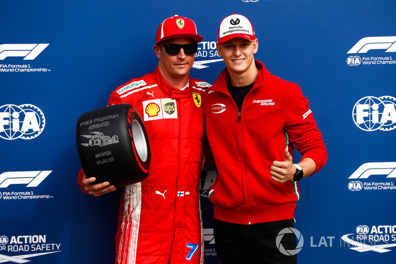 Mick Schumacher presents Kimi Raikkonen, Ferrari, with the Pirelli Pole Position award