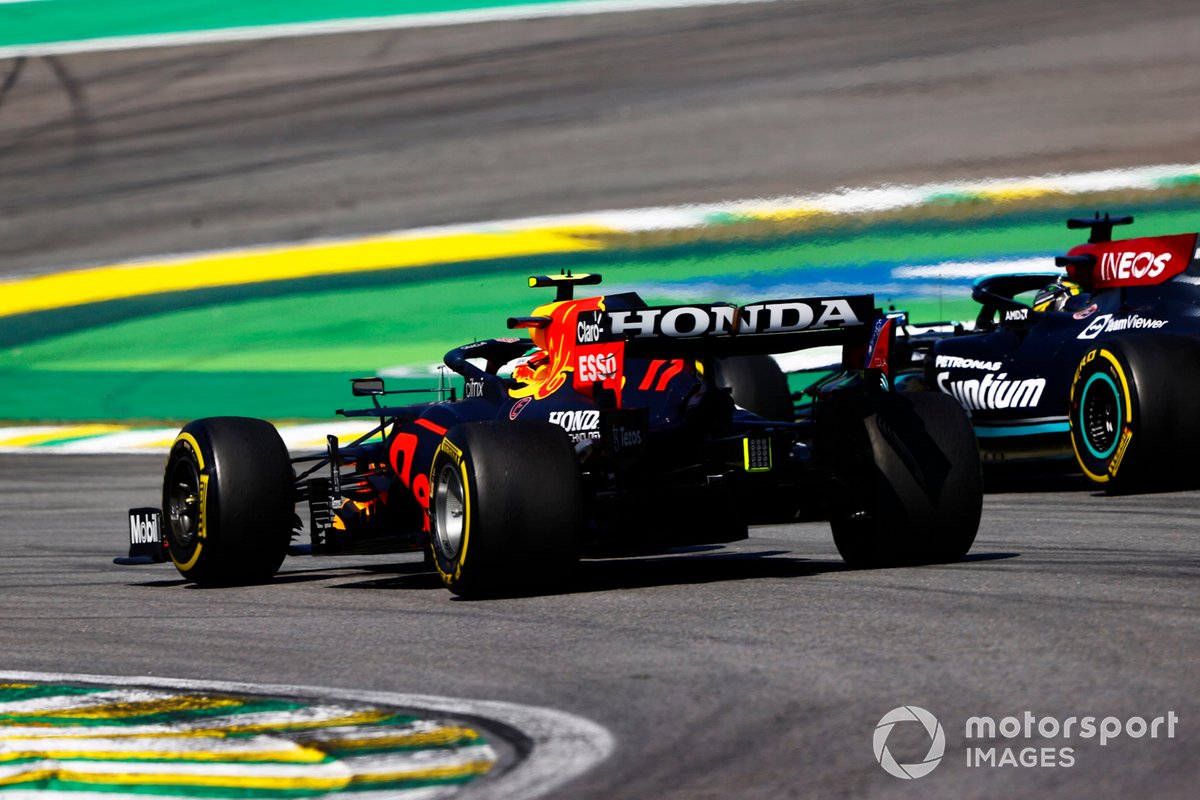 Lewis Hamilton, Mercedes W12, passes Sergio Perez, Red Bull Racing RB16B