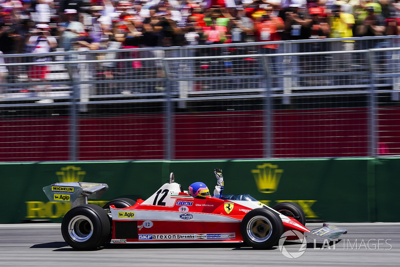 Jacques Villeneuve drives the Ferrari 312T3 raced by his father Gilles Villeneuve on a parade lap