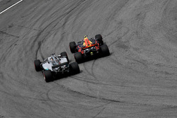 Max Verstappen, Red Bull Racing RB13 passes Lewis Hamilton, Mercedes-Benz F1 W08 for the lead