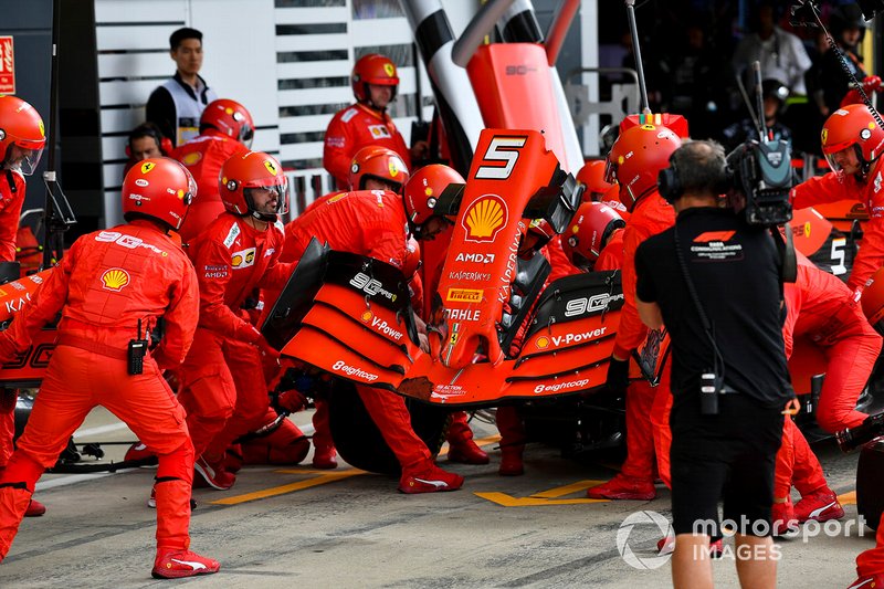 Sebastian Vettel, Ferrari SF90 pit stop for front wing change after contact with Max Verstappen, Red Bull Racing RB15