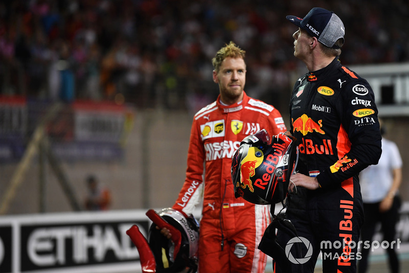 Sebastian Vettel, Ferrari, Max Verstappen, Red Bull Racing, merayakan di parc ferme usai balapan GP Abu Dhabi