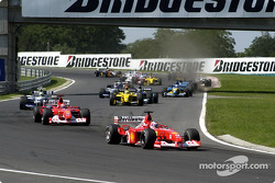 Second corner: Rubens Barrichello leading Michael Schumacher