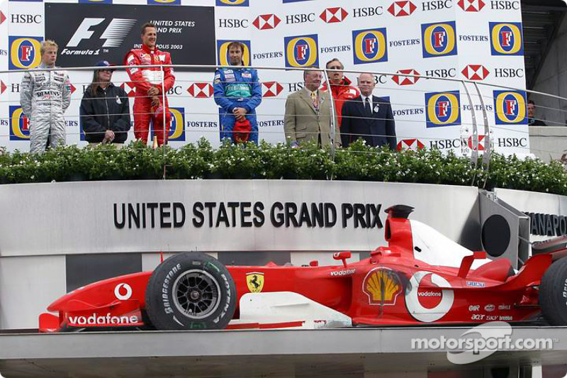 2003 (Індіанаполіс). Подіум: 1. Міхаель Шумахер, Ferrari. 2. Кімі Райкконен, McLaren-Mercedes. 3. Хайнц-Харальд Френтцен, Sauber-Petronas