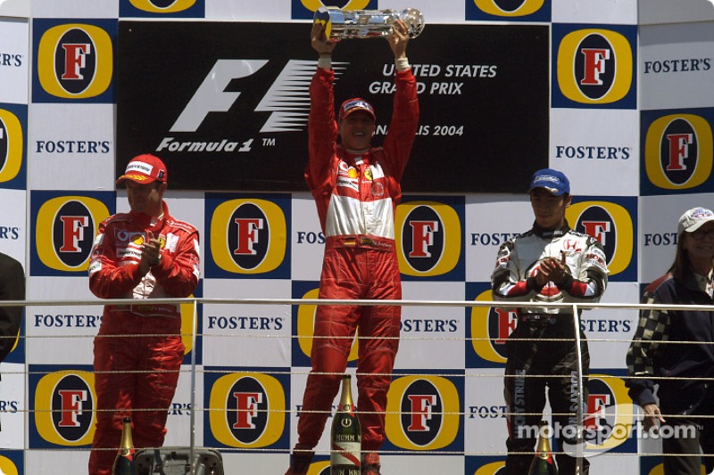2004 (Індіанаполіс). Подіум: 1. Міхаель Шумахер, Ferrari. 2. Рубенс Баррікелло, Ferrari. 3. Такума Сато, BAR-Honda