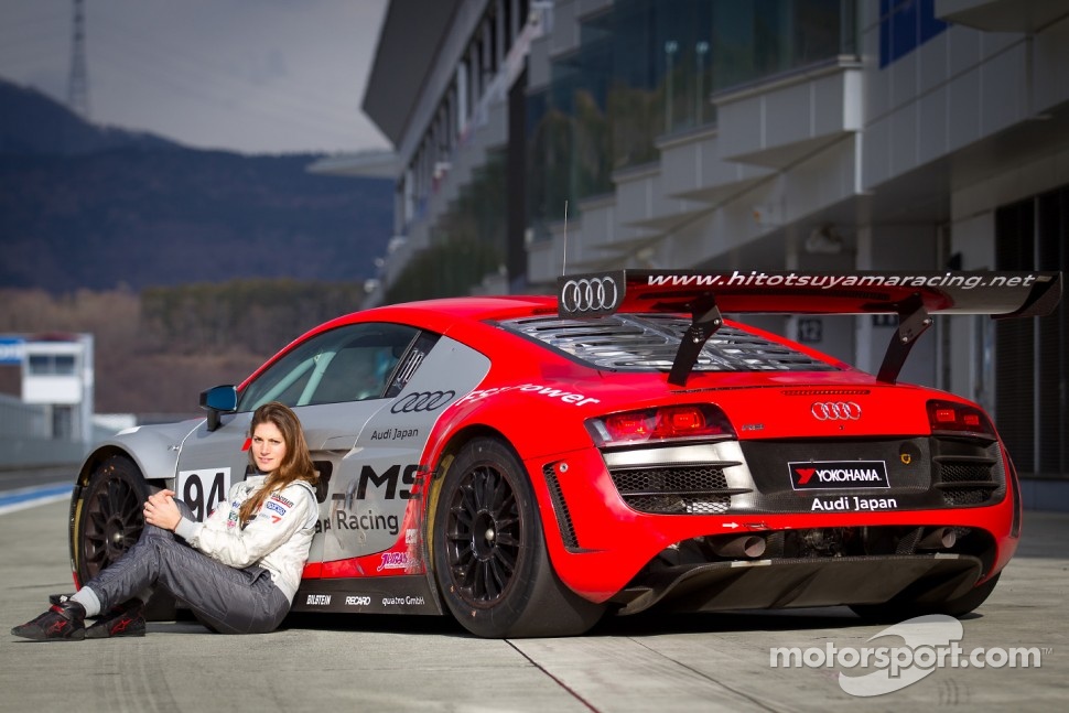 Cyndie Allemann poses with the Hitotsuyama Racing Audi R8 LMS Super GT car