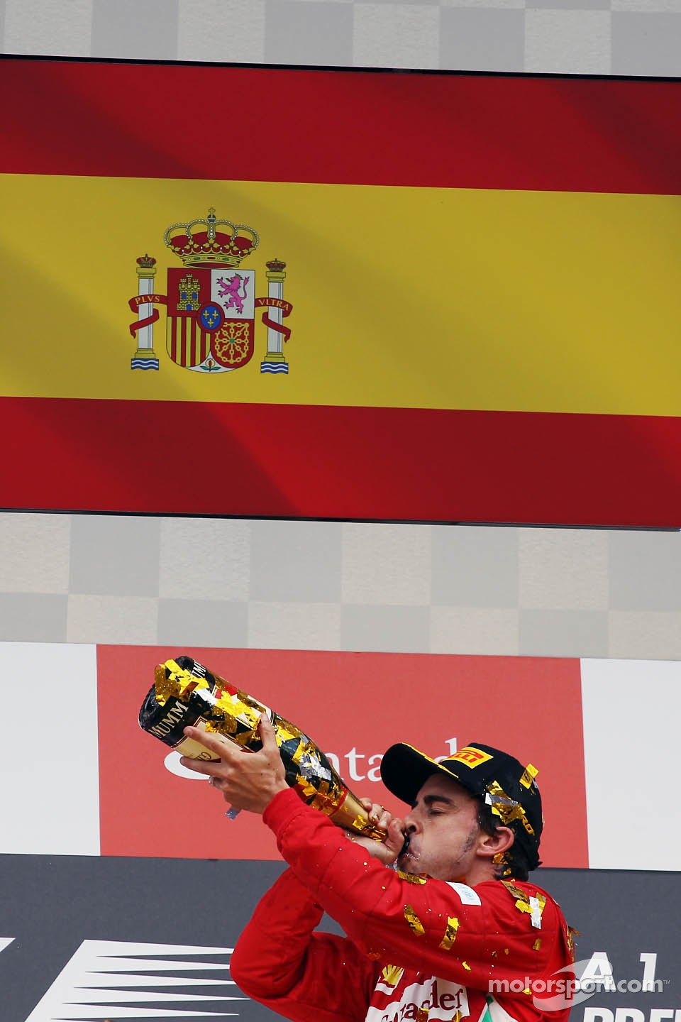 Race winner Fernando Alonso, Ferrari celebrates on the podium