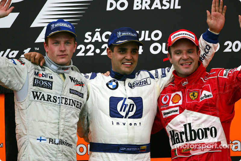 Podium: race winner Juan Pablo Montoya with Kimi Raikkonen and Rubens Barrichello