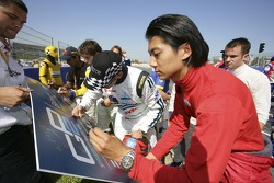 Ho-Pin Tung signs the road safety board