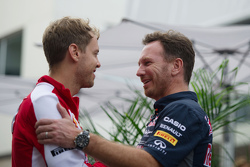 (L to R): Sebastian Vettel, Ferrari with Christian Horner, Red Bull Racing Team Principal
