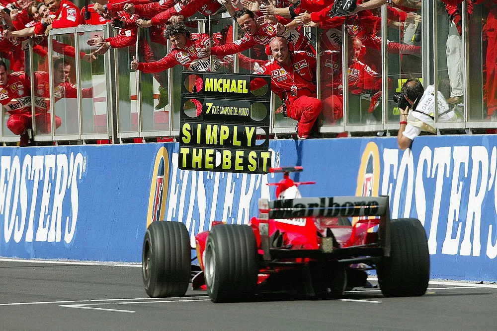 Ferrari celebrate as Michael Schumacher, Ferrari F2004, finishes in 2nd position and clinches his 7th Drivers World Championship