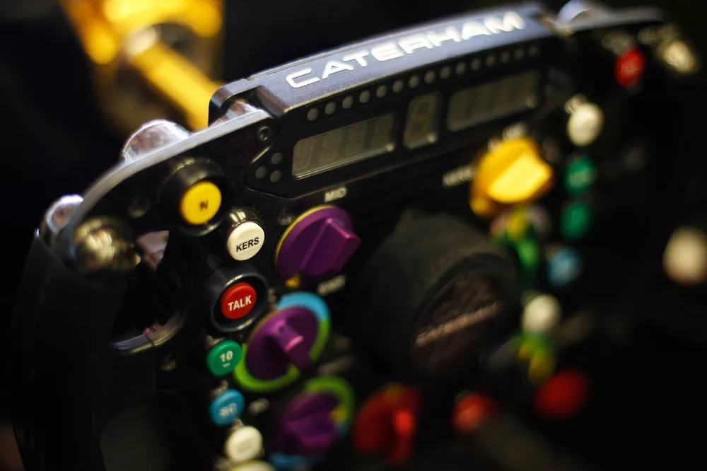 Caterham CT01 steering wheel, showing KERS and radio buttons