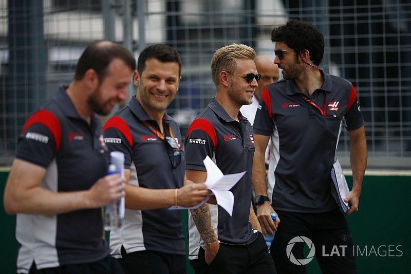 Kevin Magnussen, Haas F1 Team VF-17, makes a track walk, colleagues