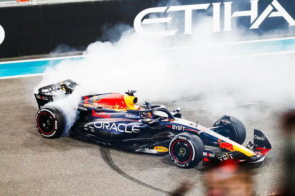 Max Verstappen, Red Bull Racing RB19, 1st position, does celebratory donuts on the grid