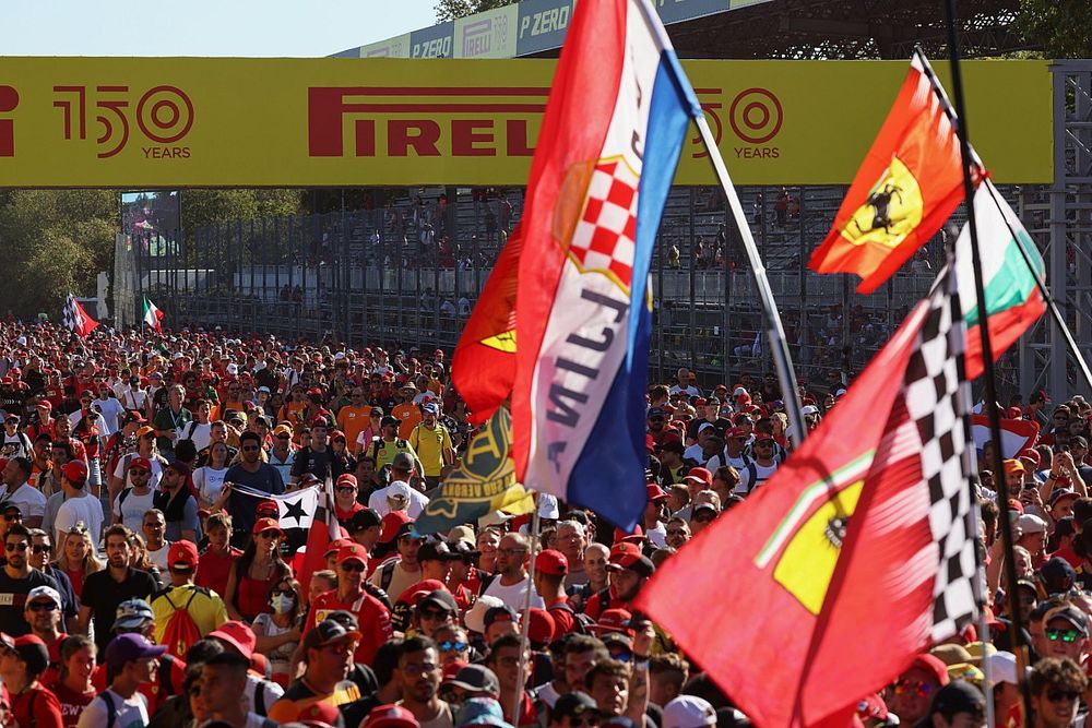 Fans flood the circuit in celebration at the end of the race